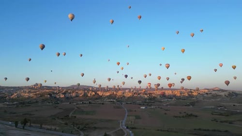 Hot Air Balloons Float Over Cappadocia at Sunrise