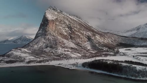 Norway's Fjords With Rugged Snowy Mountains And Coastal Waters