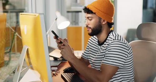 Laugh, phone and creative man typing in office with online communication, email or meme