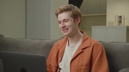 Young Adult Communicating on a Computer Indoors