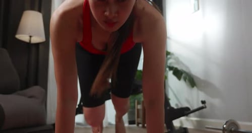 Woman Doing Mountain Climbers During Home Workout