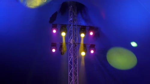 Concert Equipment with Multi Colored Spotlights in the Dark of the Circus Arena