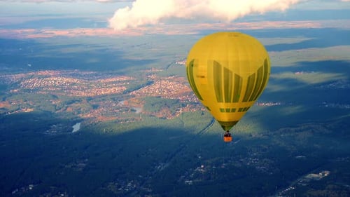 Yellow Hot Air Balloon Flying Over Vilnius City In Lithuania. - aerial