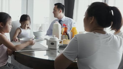 Family enjoys breakfast together at home