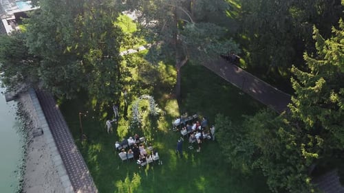 An Aerial View of a Beautiful Outdoor Gathering Happening in a Serene Green Landscape Wedding Day