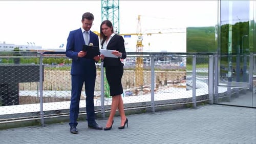 Confident Businesspersons Talking in Front of Modern Office Building Businessmen and Businesswoman