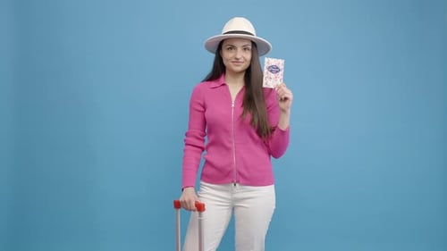 Happy Woman Holding Passport with Suitcase