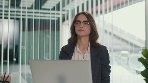 Office Manager Stretching Arms Upward For Thoracic And Lumbar Spine Health