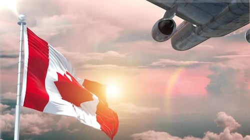 Canadian Flag Waving with Airplane Flying in Sunny Sky
