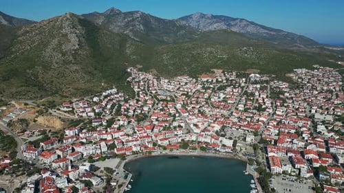 High Diagonal Drone View of Datca Rooftops and Coastline