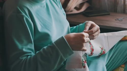 Person Doing Embroidery Close Up Indoors
