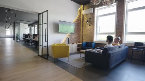 Modern Workplace with Employees Playing Pool