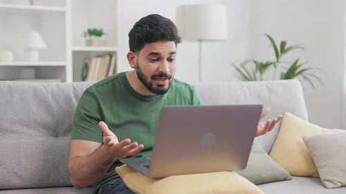 Frustrated Man Closes Laptop After Video Call