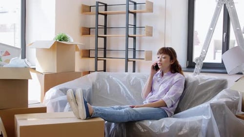 Woman Talking on Phone Relaxing in New Home