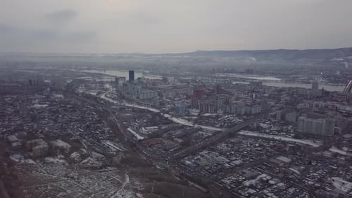 Stunning Aerial View of a Beautiful Snowy Cityscape Captured During the Winter Season Stock Clip