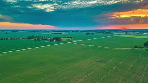 Aerial View of Green Field at Sunset