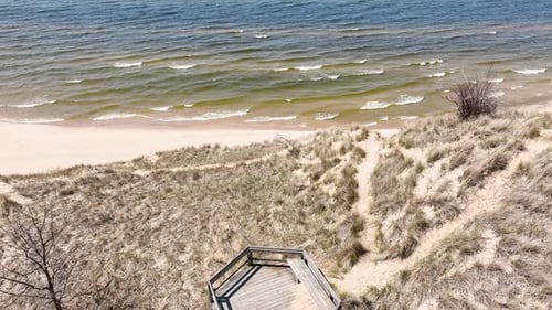 Reverse track and tilt motions showing the beach area.