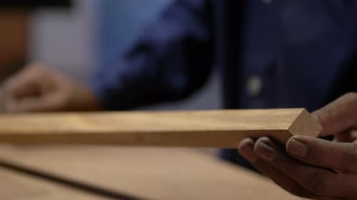 Closeup Shot Of Woodworker Installing Wood To Table Top With Glue, Furniture Making Factory