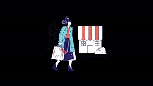 Stylish woman walking with shopping bags outside a store.