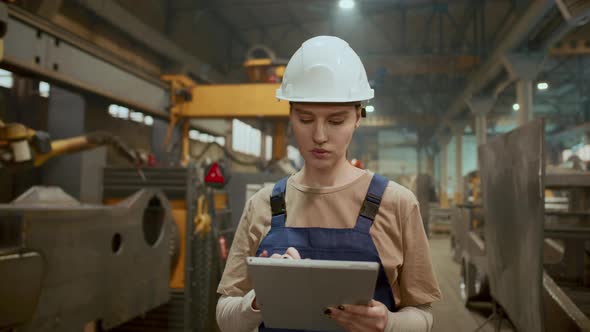 Female Production Operator Working on Digital Tablet in Industrial ...