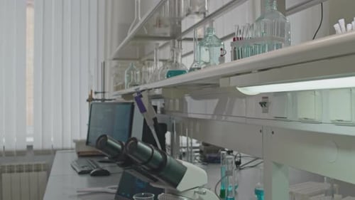Laboratory Table With Microscope and Equipment
