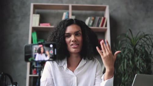 Woman Filming Herself with Smartphone