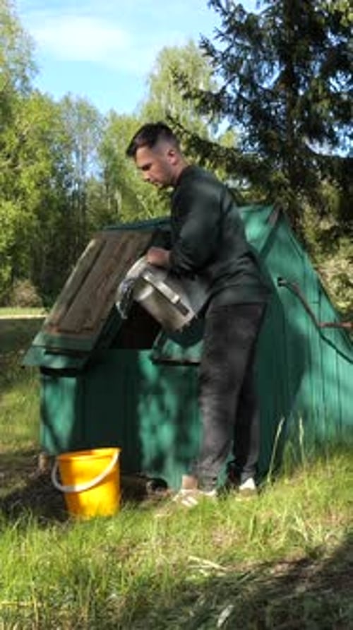 Vertical Video Man Gets Water From an Old Village Well Fresh Water Extraction