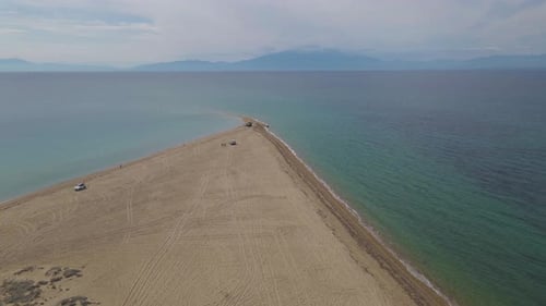 4k steady clip over a peninsula on the tropical beach of Epanomi, Halkidiki, Greece