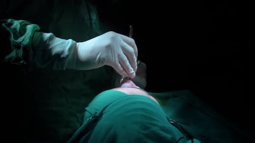 Rhinoplasty procedure and stitching doctor, end of operation.. Rhinoplasty procedure performed by a