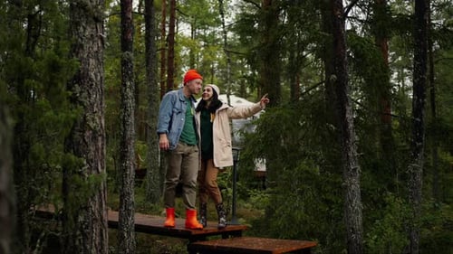 Pair Of Tourists In Nature Resting In Camping In Pine Forest EcoTourism And Traveling