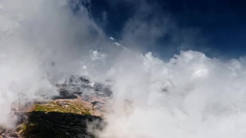 Snowcapped Mountains In The Clouds Aerial