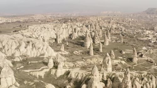 Aerial video of a panoramic view of natural rock formations in Cappadocia, Turkey