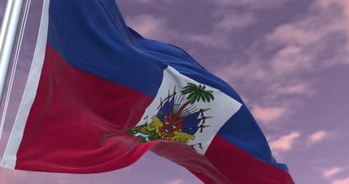 Waving Flag of Haiti against a Cloudy Sky