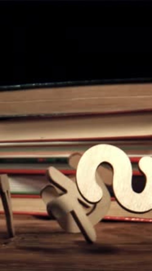 The Fall of Wooden English Letters Filmed on a Highspeed Camera at 1000 Fps