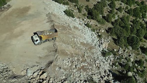 Dump Truck Emptying the Ground