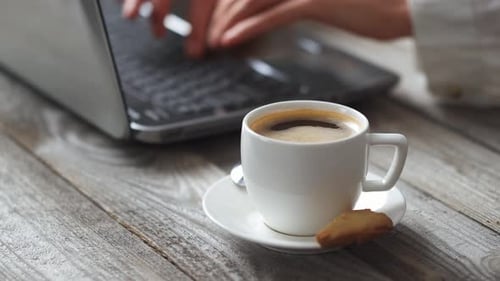Coffee and Computer on Rustic Wooden Desk