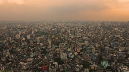 Densely populated mega city with miniature buildings - aerial top establishing drone descending shot