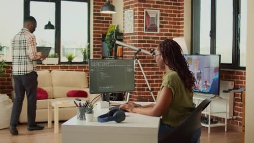 Young Woman Working on IT Software Program to Create Web Database