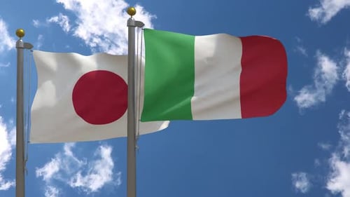 Waving Flags of Japan and Italy Against a Blue Sky