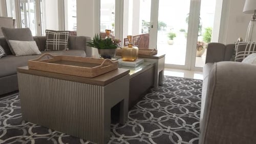 Cozy coffee table and couch in modern villa, motion view