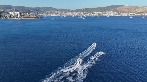 Speed Boats Cut Through the Turquoise Ocean