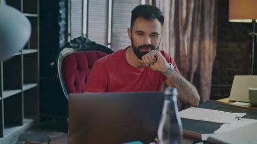 Surprised Man Smiling While Using Laptop Computer. Businessman Using Laptop in Creative