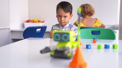 Caucasian Children Relaxing Enjoying Hobby Playing with Toy Car Remote Control Point in White