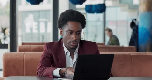 Waitress Brings Coffee to Man Working in Restaurant on Laptop Businessman Fulfills His Duties