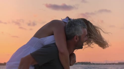 happy couple having fun on the beach slow motion