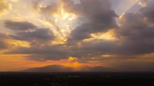 Golden Sunset Over Distant Mountains