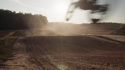 Brave Sportsman Jumps on Motorcycle Riding Along Hilly Ground