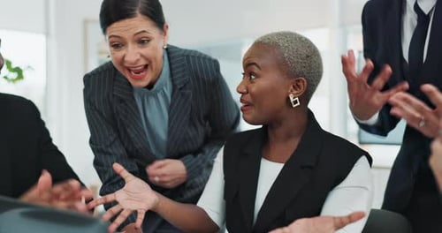 Excited Business Team Celebrates Success in the Workplace