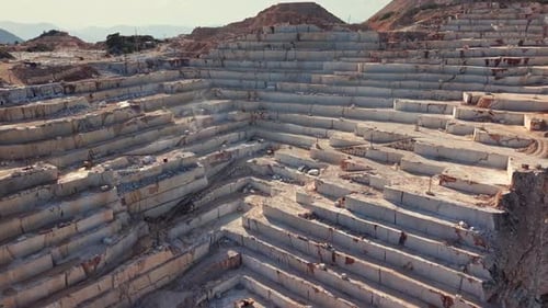 Aerial Perspective of Large Geometric Terraces in a Marble Quarry