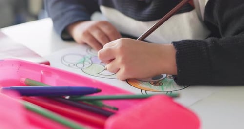 Creativity, school and hands of child drawing in a classroom for art lesson for education